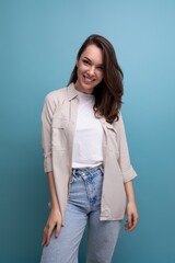 charming 30s woman with chic black well-groomed hair in a beige shirt