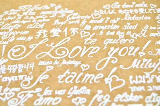 I love you phrase written in heart shape in all languages on cardboard envelope