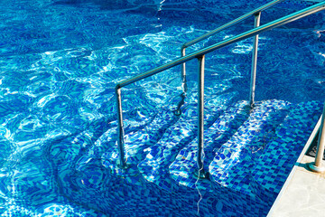 descent into the pool with blue water