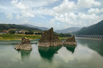 Fototapeta na wymiar Mountain landscape with a lake and a bridge in the background, Stone Gate in South Korea