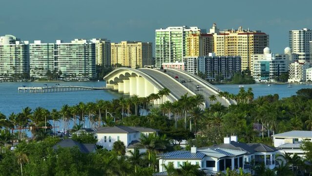 Aerial view of Sarasota city downtown with Ringling Bridge and high-rise office buildings on horizon. Real estate development in Florida. USA travel destination
