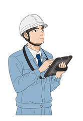 タブレットに入力する若手の現場監督