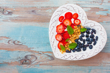 Yogurt with grain and fresh berries. Space for text.