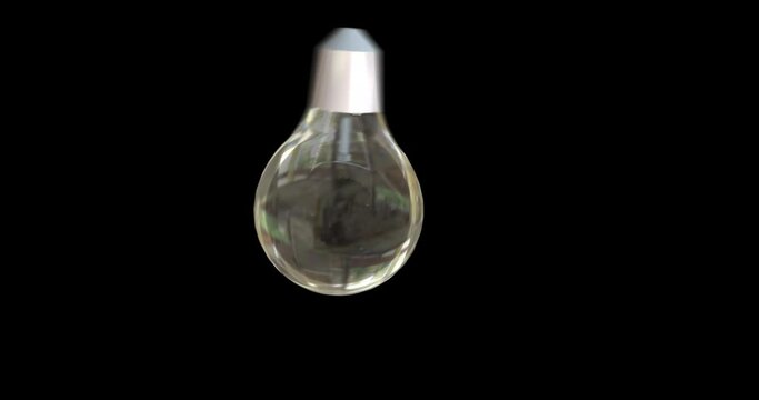 Animation of light bulb spinning on black background