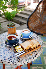 simple and comforting breakfast with breads and cups of tea. western style breakfast in the morning