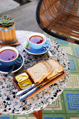 simple and comforting breakfast with breads and cups of tea. western style breakfast in the morning