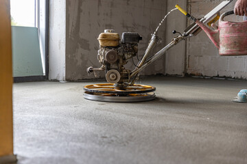 Polishing sand and cement screed floor