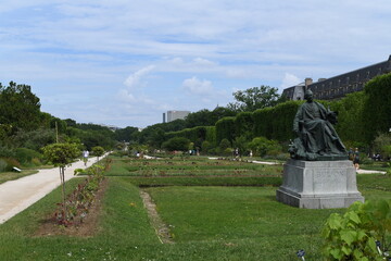 Beautiful view of Paris botanical garden with in foreground a George Louis Buffon statue, a famous french naturalist.
