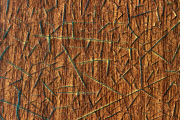 Texture of an old wooden beige table covered with a layer of cracked lacquer