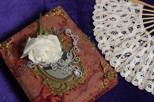 White Rose on Antique Book With Crystal Rhinestone Necklace