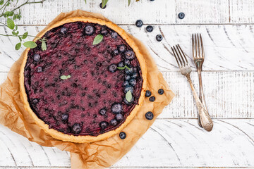 Traditional finnish blueberry pie. National blueberry day - july 8. Top view. Copy space