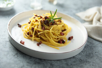 Spaghetti with bacon and rosemary