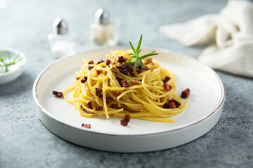 Spaghetti with bacon and rosemary