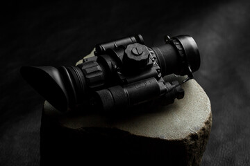 optical night vision scope on black background