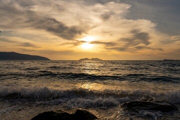 Naklejka premium Sunset view over the bay, shot from the beach, red sky, in Albania