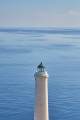 White lighthouse cliff overlook seascape daytime Punta Palascia Otranto Italy