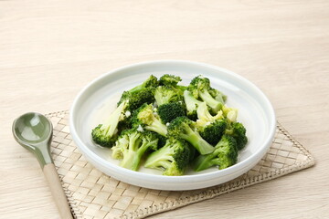 Stir fried broccoli or ca brokoli, Indonesian food, served in a bowl.
