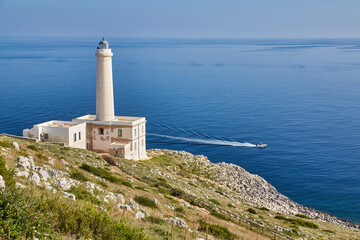 Fototapeta na wymiar lighthouse of Cape of Otranto in Apulia standing on hard granite rocks is the most easterly point of Italy, marks the meeting of the Ionian Sea and the Adriatic Sea.
