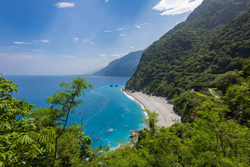 Stunning view reveals the grandeur of the cliffs at Taiwan southeast coast, Qingshui Cliff near Taroko National Park. Towering and lush, they overlook the azure sea, evoking a sense of awe. Landscape