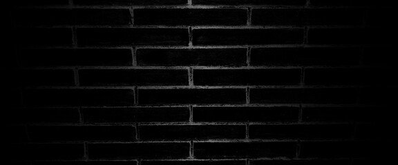 Obraz premium Black brick wall, dark background for design, texture of a perfect black brick wall as background or wallpaper, brick surface backgrounds. black brick wall backgrounds, brick wall light room. 