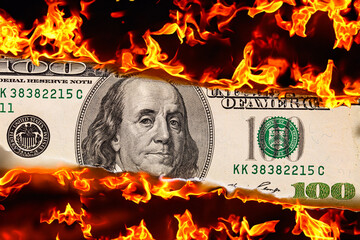 100  US dollar banknote in flame