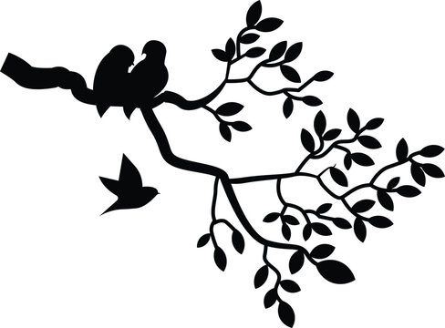 Tree branch silhouette with birds flying