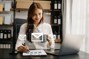 Woman hands using Laptop, tablet typing on keyboard and surfing the internet with email icon, email...