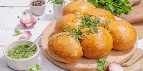 Aromatic garlic buns. Fresh baked goods, a traditional gluten-free soup snack. Parsley, spices