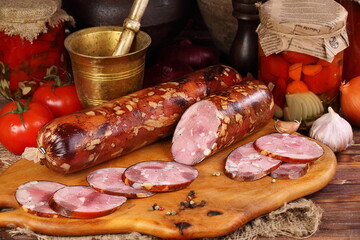 Still life with ham on a wooden background