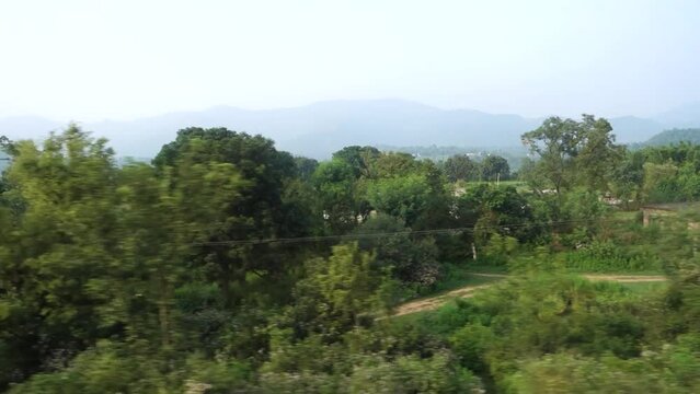 July 5th 2022 Katra, Jammu and Kashmir, India. Captivating train window view, passing landscapes in motion.