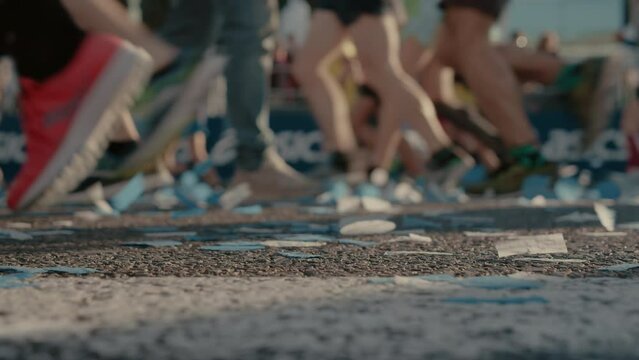 Marathon runners on start or finish line. Beginning of urban city marathon in Barcelona, Spain. Celebrating athletic event or competition
