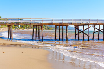 Sunny Day at Malibu Beach: Wooden Pier and Sandy Shores