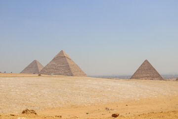 Panoramic Landscape view of Giza pyramids on a bright day - obrazy, fototapety, plakaty