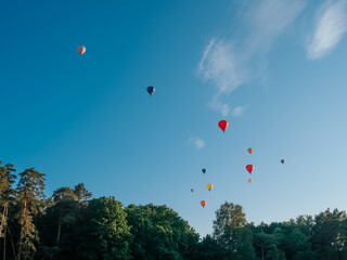 Vilnius, Lithuania - 06 13 2023: Hot air balloons in Vilnius. Colorful balloons in the sky above the city