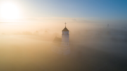 Old church on a foggy morning