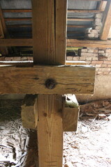 A wooden post with a hole in it