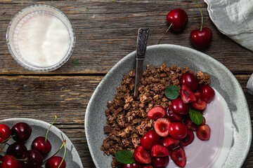Granola with yogurt and cherries in a bowl
