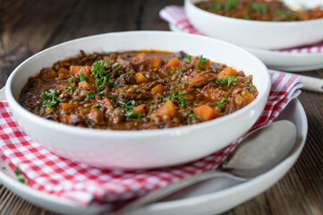 Stew with beef meat, lentils and vegetables on a plate