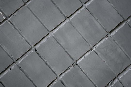 gray-colored tiled background is a visually appealing element that adds a subtle and neutral tone to the overall design, neutral and restrained design element