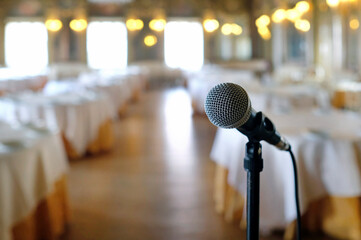 Selective focus on a microphone in an elegant room prior to an event