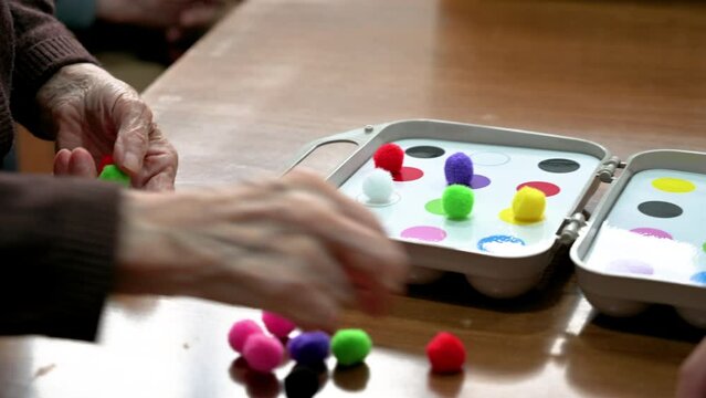Rehabilitation center. Brain therapy cognitive psychological testing on senior patient. Alzheimer's disease and dementia prevention concept. Adaptation skills recovery. High quality 4k footage.
