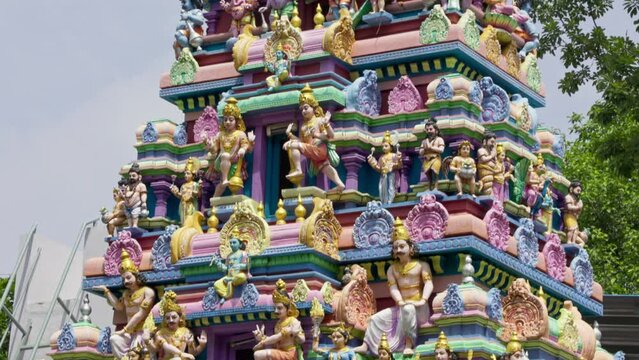 The Indian Hindu temple features a Shikhara adorned with sculptures of gods