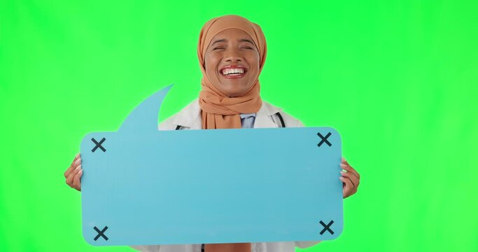 Speech bubble, muslim woman and doctor in studio with green screen for marketing mockup space. Happy, smile and islamic medical worker with voice board with tracking markers by chroma key background.