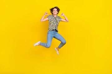 Fototapeta na wymiar Full length photo of funky cool lady wear animal print shirt pointing herself thumbs jumping high isolated yellow color background