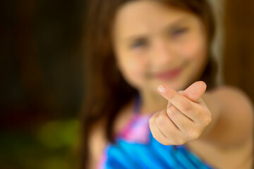 Heartfelt Joy A Girl Making the Heart Symbol, hands, heart, love, gesture, symbol