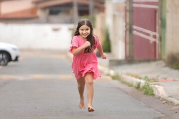 girl running towards the camera, running, playful, energetic, active