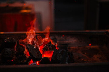 Banner fire with firewood in the grill with space for text. Stylish outdoor cooking concept