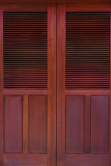 Brown doors made of natural wood. Stylish shutters and wooden backgrounds