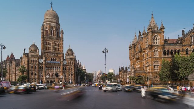 Timelapse view of traffic in front of historic landmark Chhatrapati Shivaji Terminus aka Victoria Station in South Mumbai, Maharashtra, India, zoom in. 