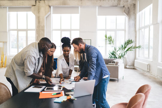 Diverse colleagues working on project in office